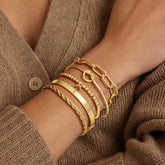 Turandoss Dainty 5PCS Initial A 14K Gold Plated Beaded Stretch Bracelet Non Tarnish Stackable Tie Knot Cuff Twisted Paperclip Bracelet Jewelry Easter Gifts for Women